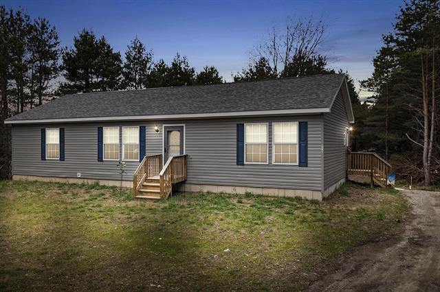 front view picture of 714 Se Saunders Road, Kalkaska, MI. 49646