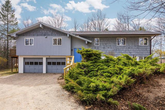 front view picture of 8822 Bahle Road, Suttons Bay, MI. 49682