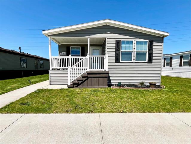 front view picture of 57865 Woodcreek, New Haven, MI. 48048