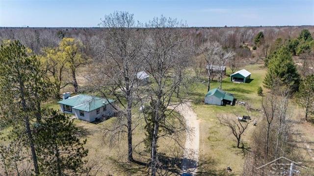 front view picture of 1697 Three Rivers Road, Gladwin, MI. 48624