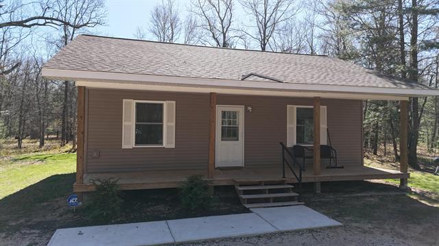 front view picture of 2073 Gunn Road, Manistee, MI. 49660