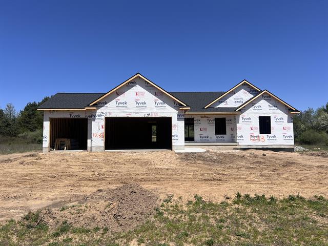 front view picture of 1233 Secluded Pines Drive, Sparta, MI. 49345