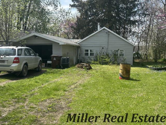 front view picture of 7755 Woodland Road, Lake Odessa, MI. 48849
