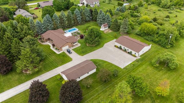front view picture of 7373 Dell Road, Saline, MI. 48176