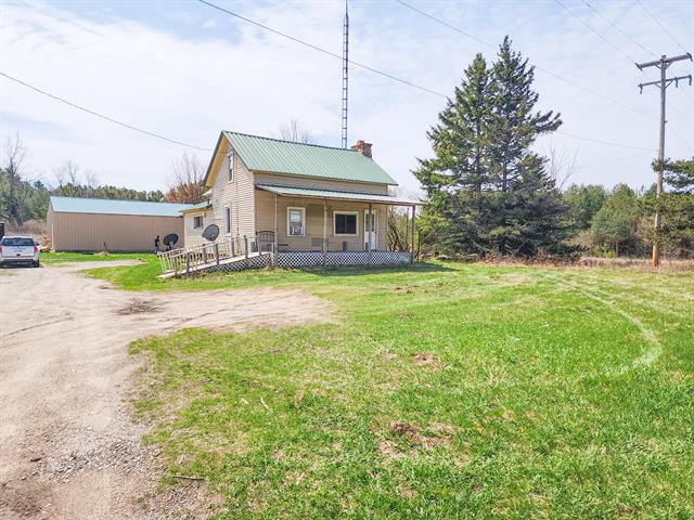 front view picture of 17535 18 Mile Road, Leroy, MI. 49655
