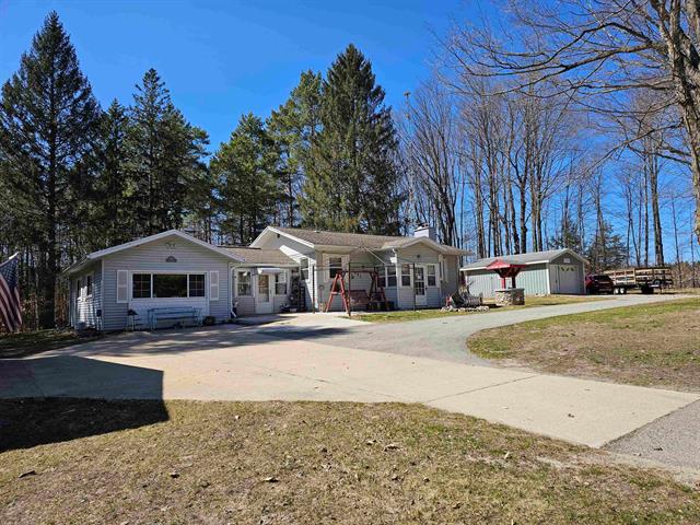 front view picture of 7497 N 7 Mile Road, Lake City, MI. 49651
