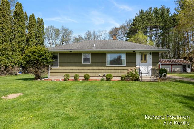 front view picture of 827 12 Mile Road Nw, Sparta, MI. 49345