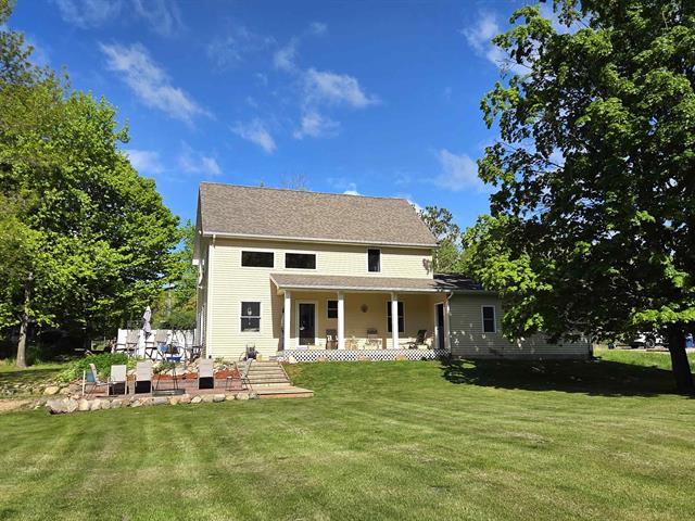 front view picture of 734 N Rolland Road, Weidman, MI. 48893