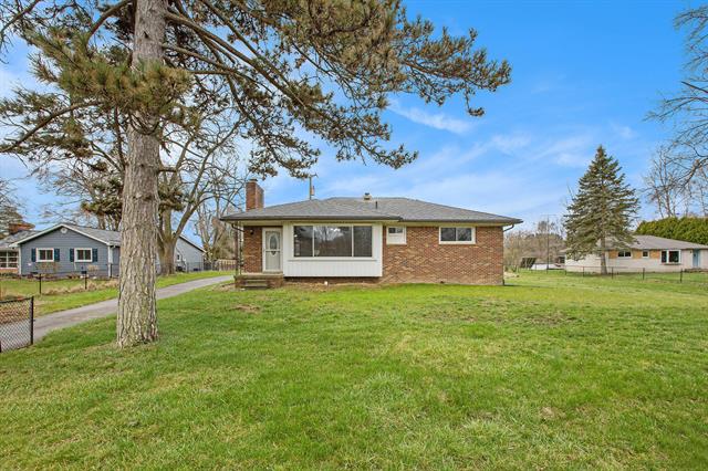 front view picture of 7624 6 Mile Road, Northville, MI. 48168