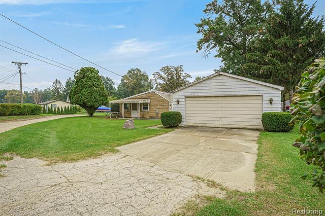 front view picture of 9495 Garforth St, White Lake, MI. 48386