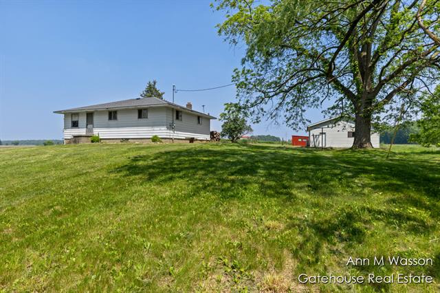 front view picture of 12407 Bliss Road, Lake Odessa, MI. 48849