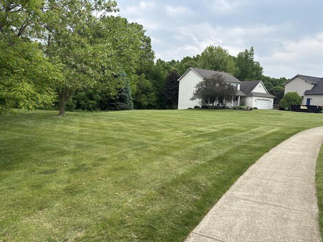 front view picture of 1353 Morning Mist Drive, Howell, MI. 48843