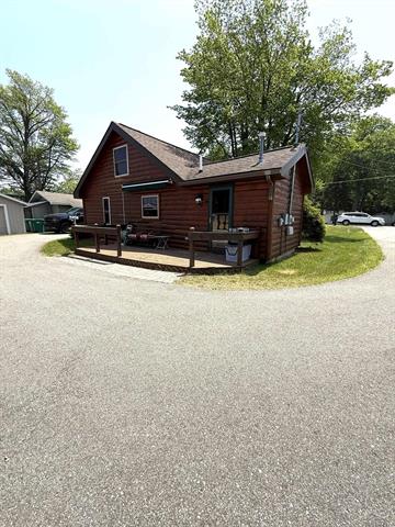front view picture of 584 W Houghton Lake Drive, Prudenville, MI. 48651
