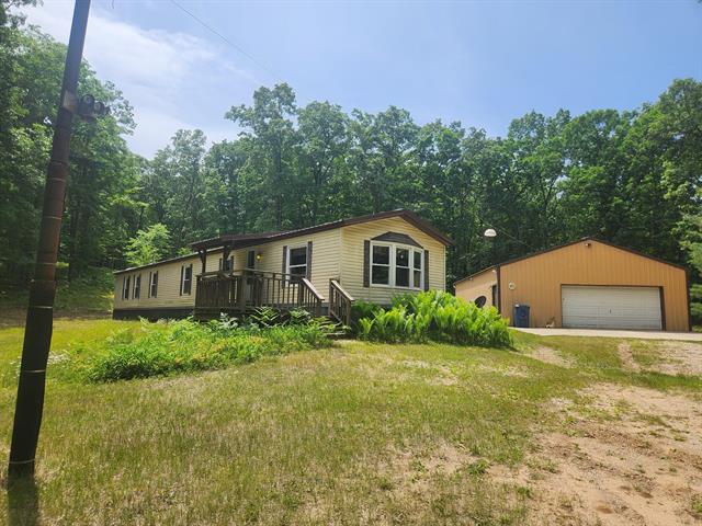 front view picture of 1593 W Centerline Road, Baldwin, MI. 49304
