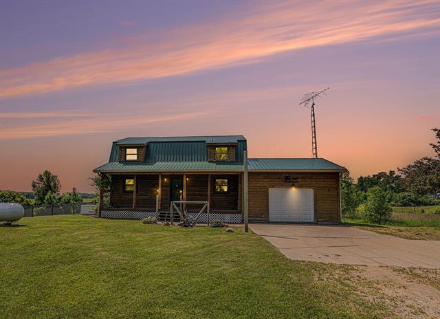 front view picture of 11248 E Mannsiding Road, Gladwin, MI. 48624