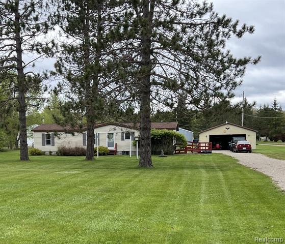 front view picture of 6858 W Emery Road, Houghton Lake, MI. 48629