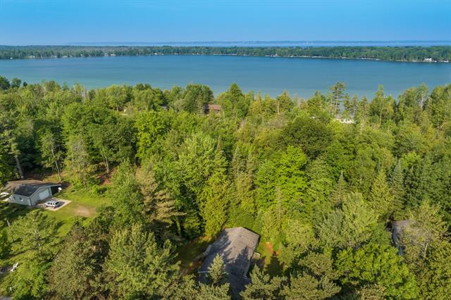 front view picture of 6615 Forest Drive, Kewadin, MI. 49648