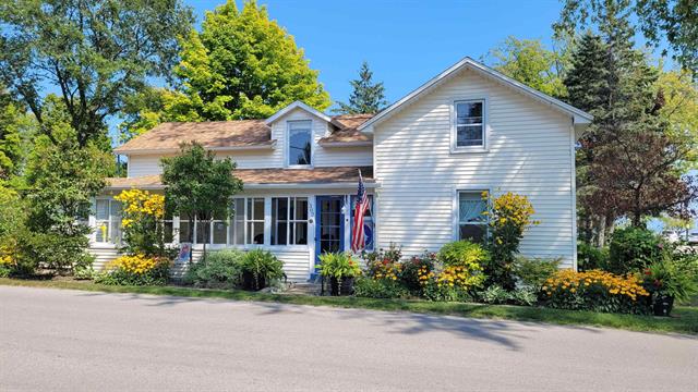 front view picture of 302 N Rose Street, Northport, MI. 49670