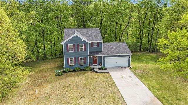 front view picture of 11889 Buck Hollow Court, Gowen, MI. 49326