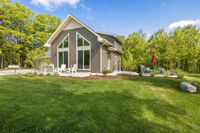 front view picture of 2013 E Kasson Road, Cedar, MI. 49621