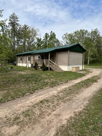 front view picture of 11698 N Astor Road N, Irons, MI. 49644