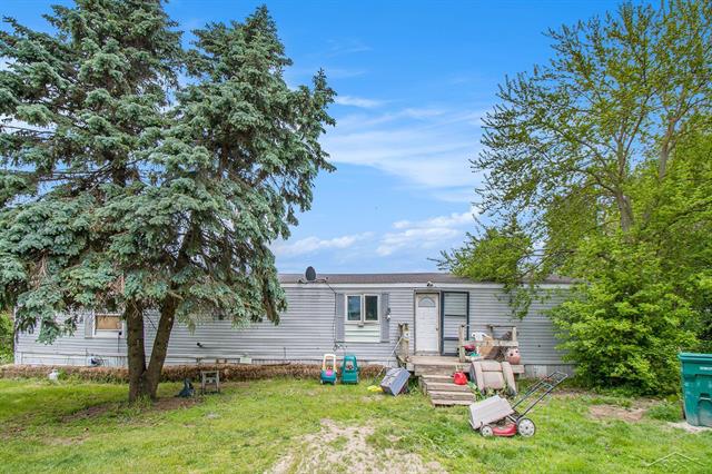 front view picture of 8305 Goodwin Road, Lyons, MI. 48851