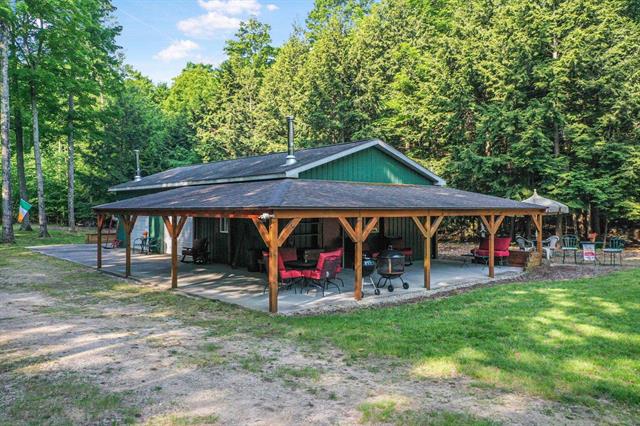 front view picture of 405 E Shetland Trail, Cedar, MI. 49621