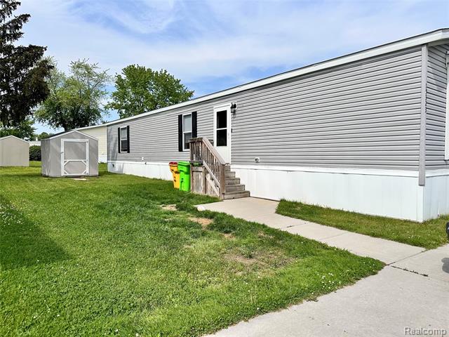front view picture of 15323 Enchante Drive, Clinton Township, MI. 48038