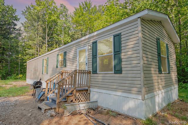 front view picture of 4985 Wilson Road, Harrison, MI. 48625