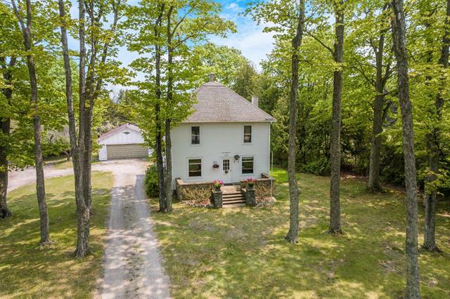 front view picture of 12570 N Cathead Point Road, Northport, MI. 49670
