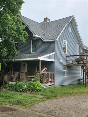 front view picture of 122 John Street, Lyons, MI. 48851