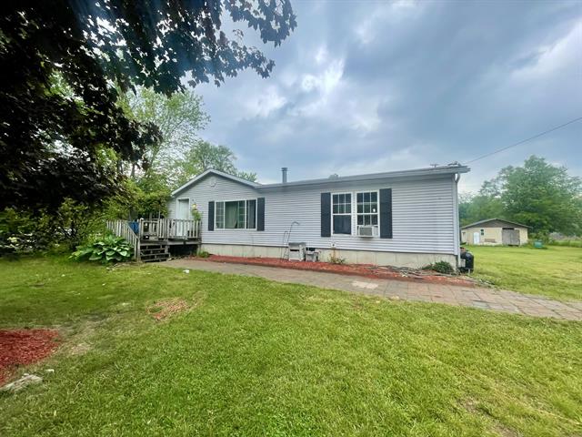 front view picture of 240 Grand Street, Michigan Center, MI. 49254