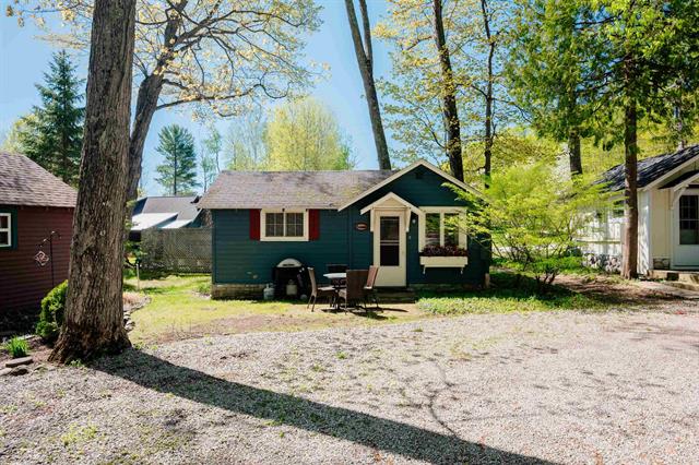 front view picture of 429 S Shabwasung Street, Northport, MI. 49670