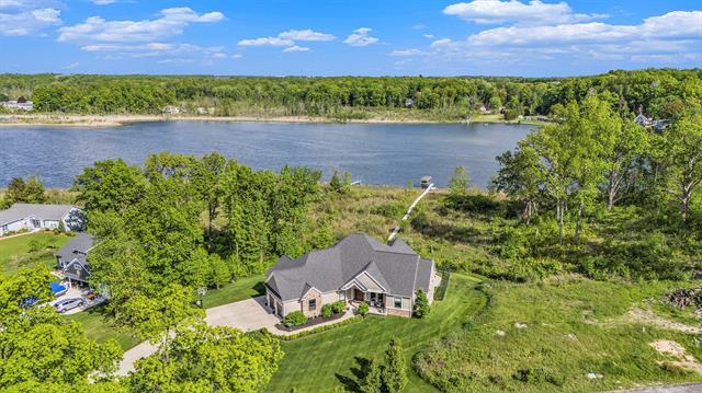 front view picture of 9482 Wabasis Pointe Drive Ne, Greenville, MI. 48838