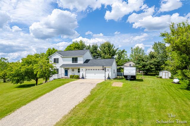 front view picture of 12299 Downes Street Ne, Lowell, MI. 49331