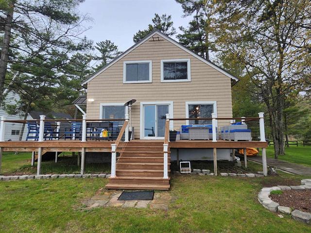 front view picture of 197 Iosco Beach Road, East Tawas, MI. 48730