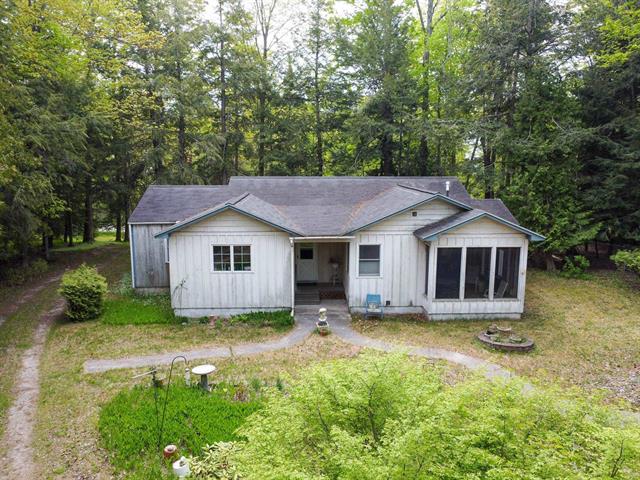 front view picture of 10895 N Shore Drive, Northport, MI. 49670