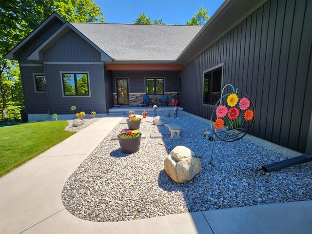 front view picture of 6238 E Gallivan Road, Cedar, MI. 49621