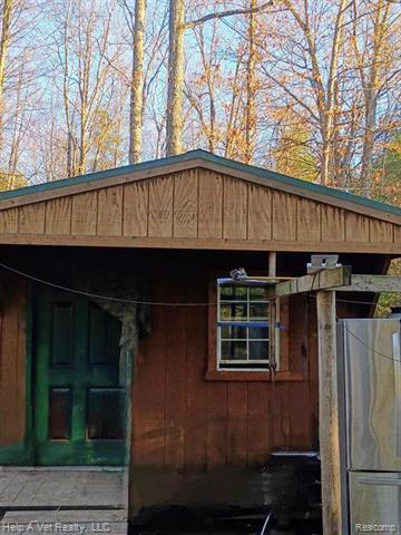 front view picture of 6651 W 6 Mile Road, Irons, MI. 49644
