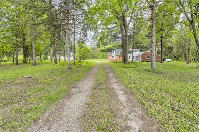 front view picture of 8925 Chubb Road, Northville, MI. 48168