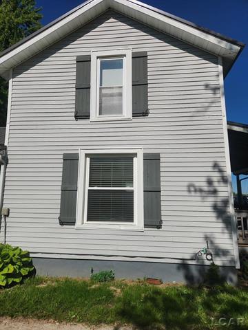 front view picture of 11089 Pearl Street, Clayton, MI. 49235