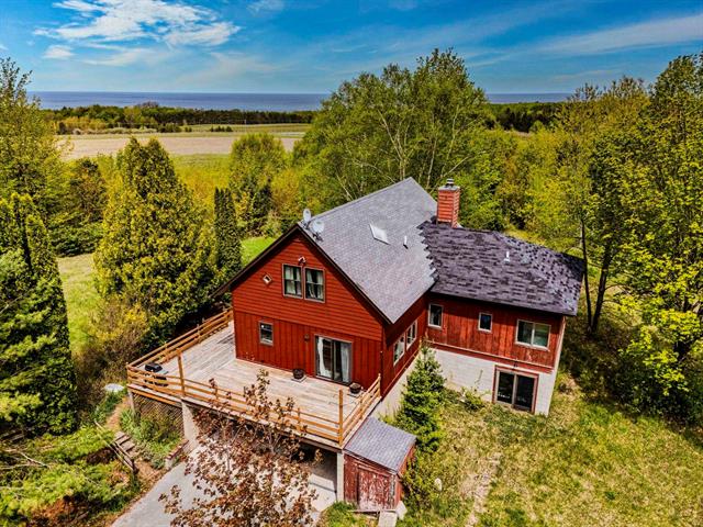 front view picture of 6400 N Manitou Trail, Northport, MI. 49670