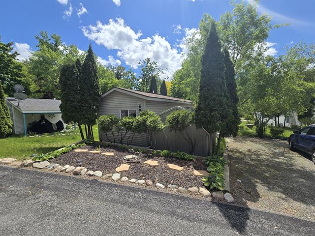 front view picture of 13033 19 Mile Rd Lot 65, Gowen, MI. 49326