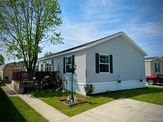 front view picture of 5239 Americana Ln, Casco, MI. 48064