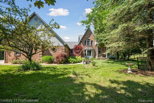 front view picture of 6279 7 Mile Road, South Lyon, MI. 48178