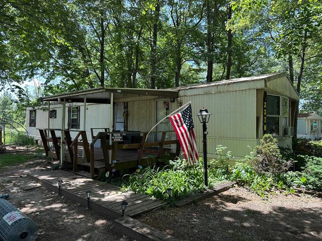 front view picture of 3320 S Circle Drive Ne, Kalkaska, MI. 49646