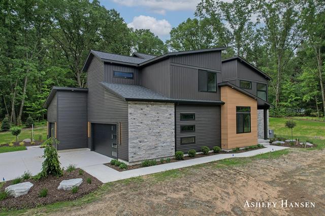 front view picture of 8332 Ramsdell Drive Ne, Rockford, MI. 49341