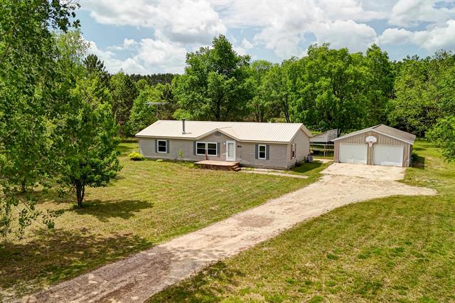 front view picture of 1227 Ne Darke Road, Kalkaska, MI. 49646