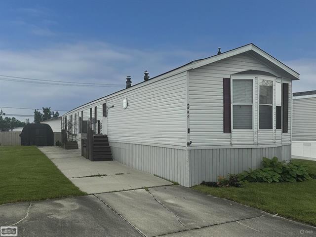 front view picture of 20456 Harmony Drive, Clinton Township, MI. 48036