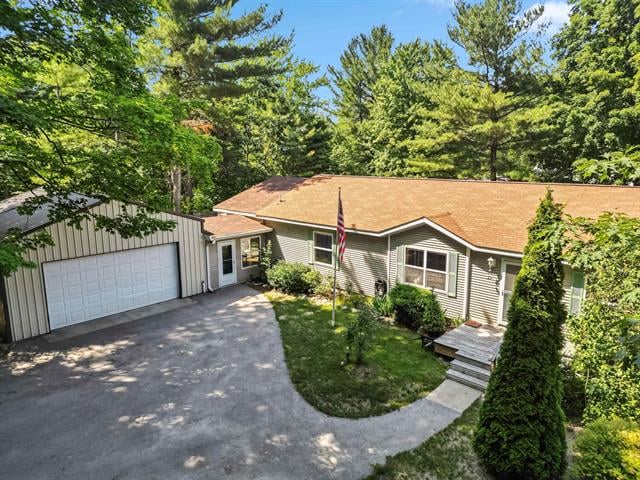 front view picture of 6732 Hickory Drive, Kewadin, MI. 49648